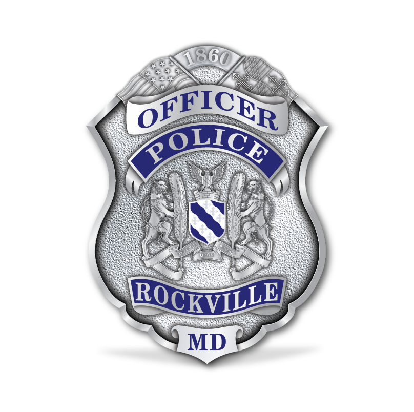 Silver badge with blue text reading "Officer Police Rockville MD" and "1860" at the top, featuring an eagle and American flags in the design.